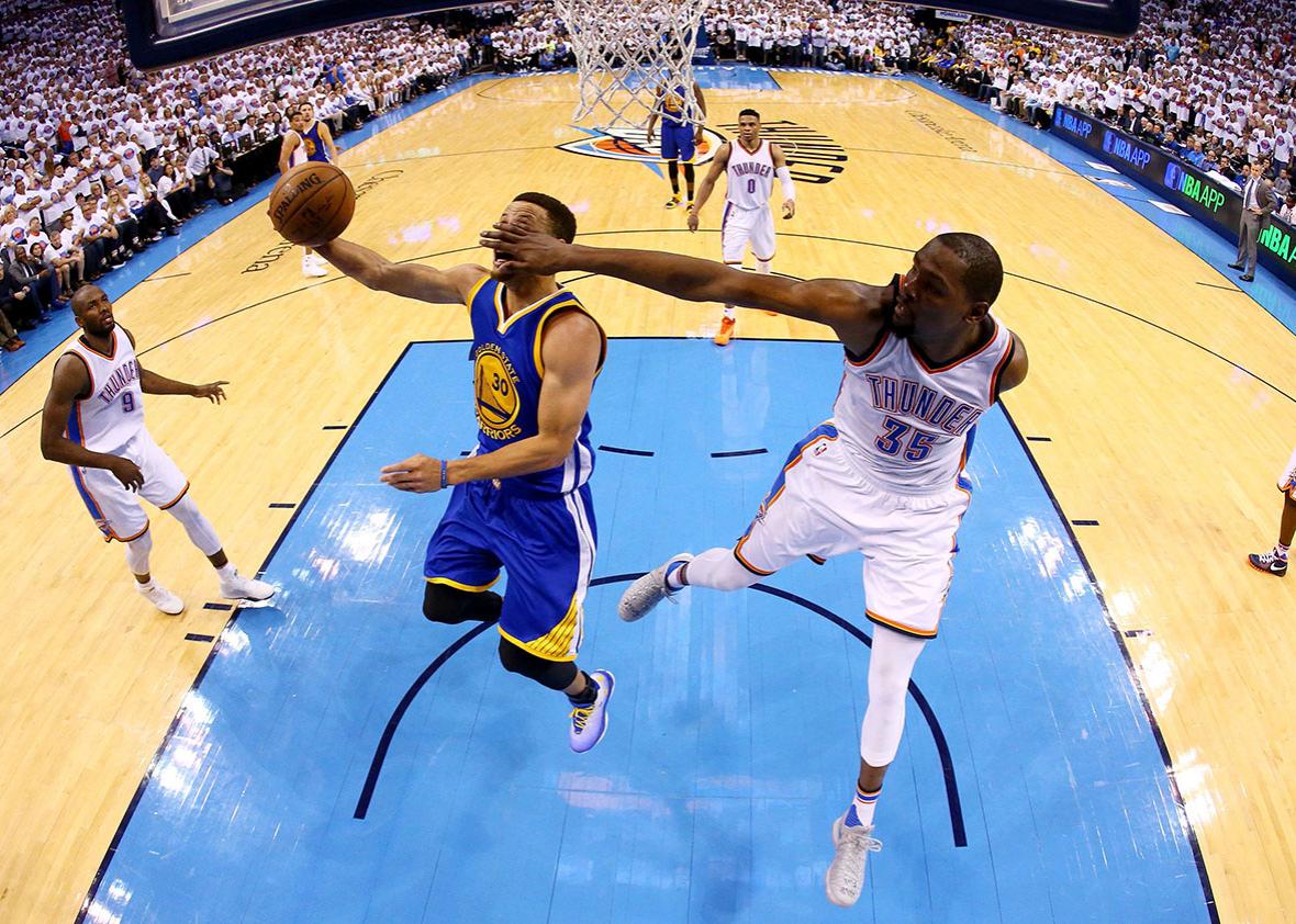 Stephen Curry of the Golden State Warriors goes up against Kevin Durant of the Oklahoma City Thunder during game four of the Western Conference Finals in Oklahoma City on Tuesday.