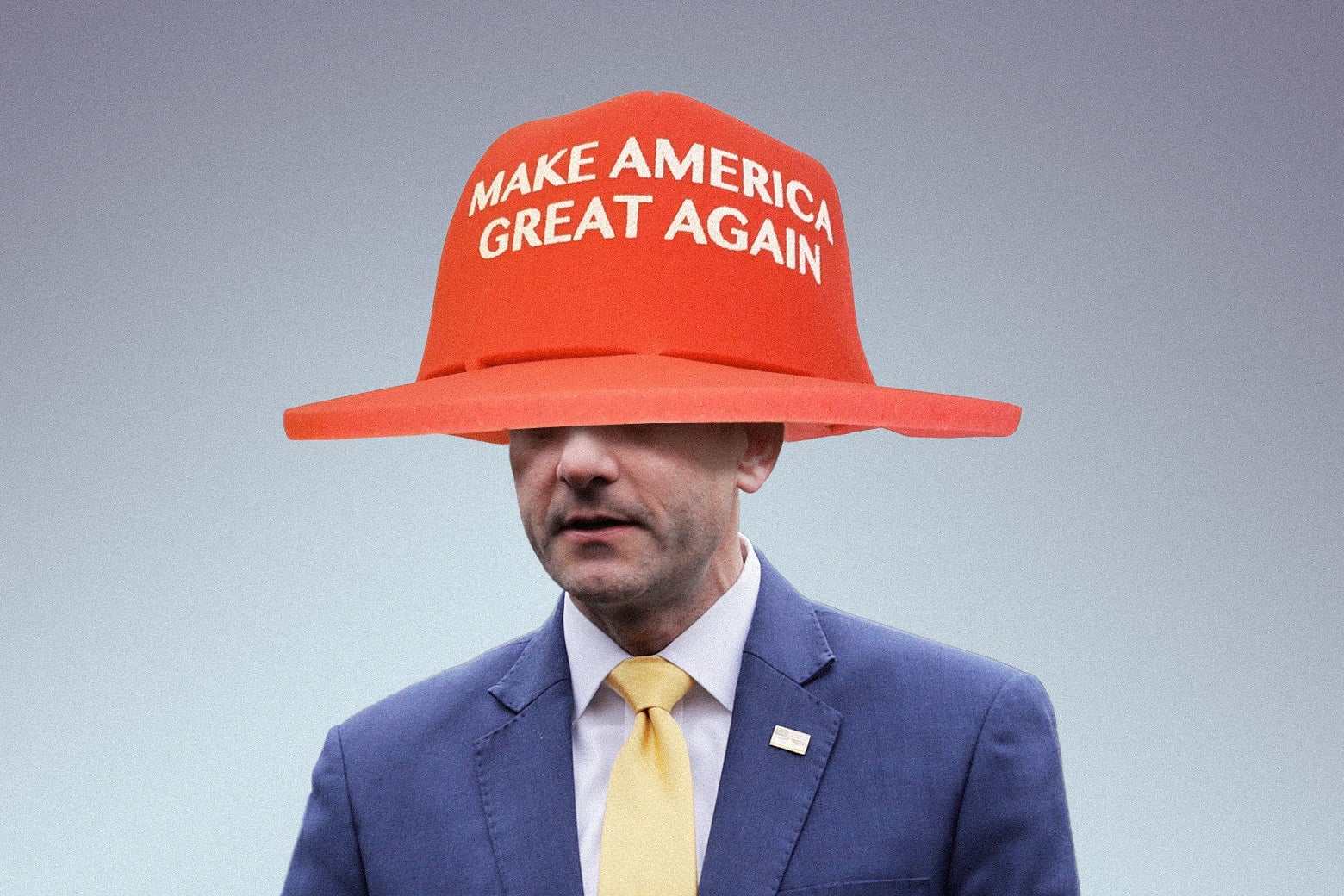 Ryan is seen in an enormous red Make America Great Again hat that is obscuring his eyes.