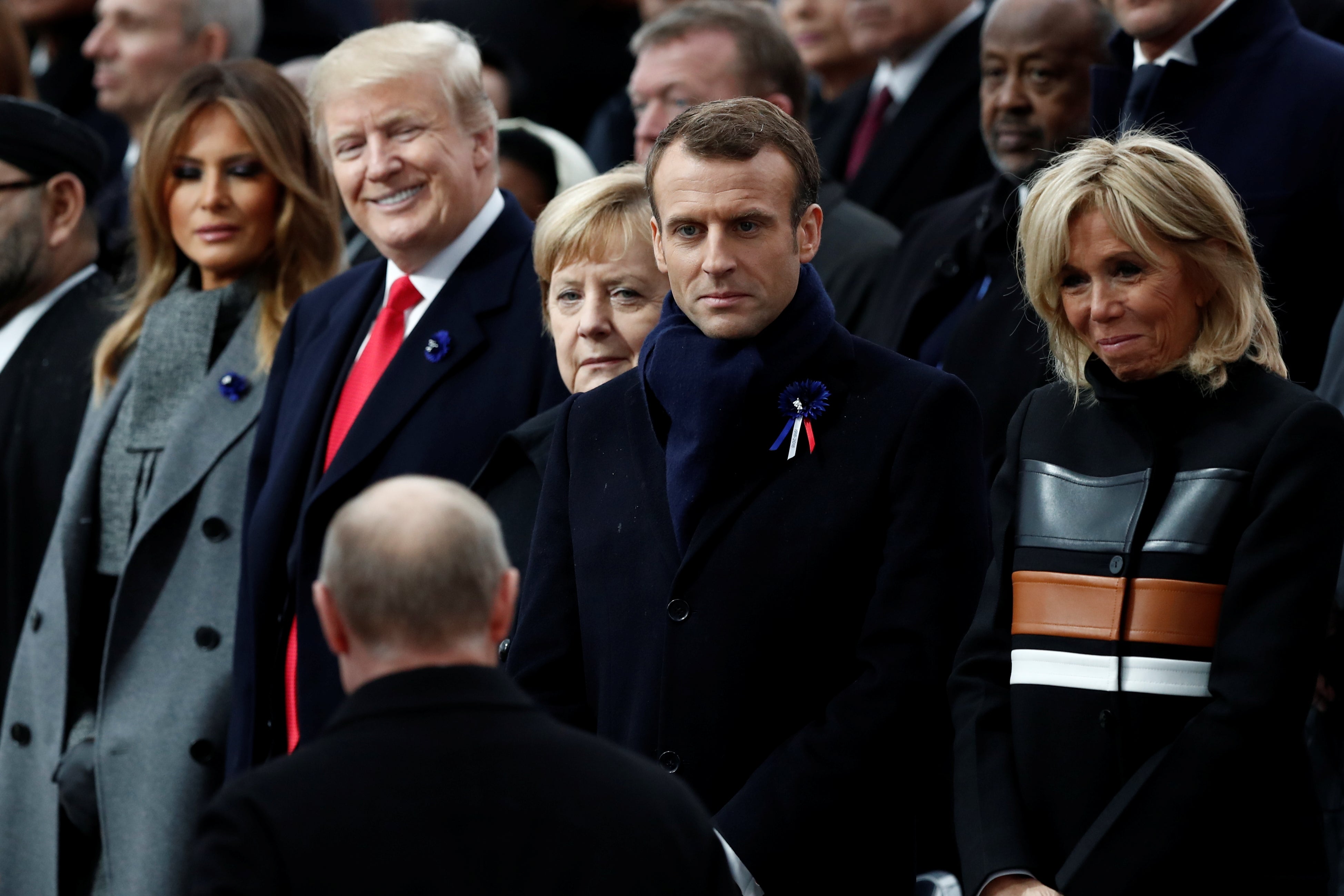 Russian President Vladimir Putin arrives to take his place with French President Emmanuel Macron, Brigitte Macron, German Chancellor Angela Merkel, President Donald Trump, and first lady Melania Trump at the Arc de Triomphe in Paris, France on November 11, 2018. 