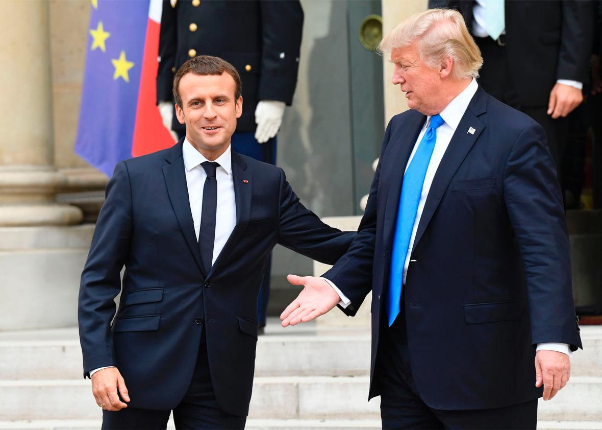 In Paris, Macron Turns On The Charm For Trump.