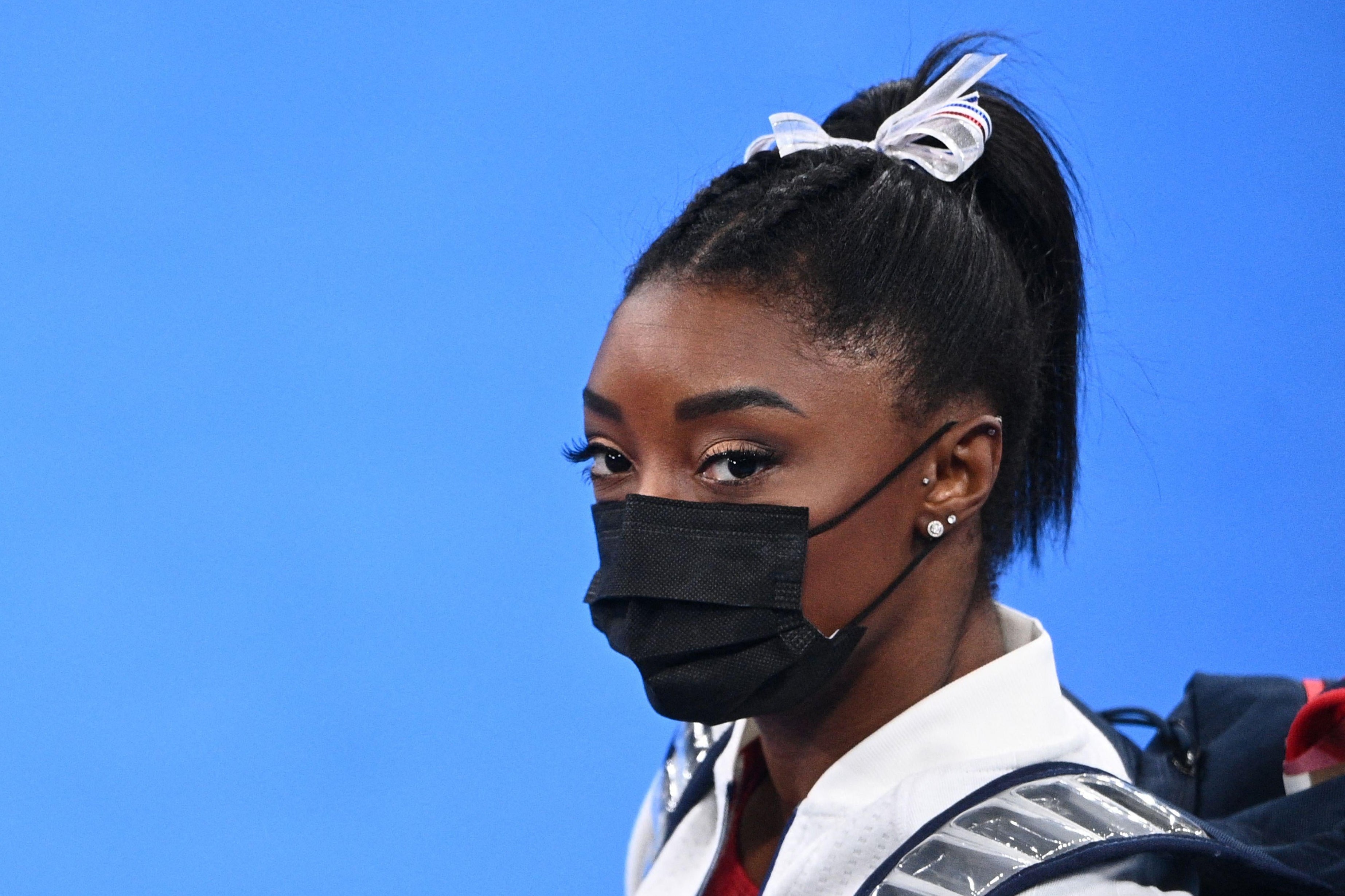 Biles in a mask looking stonefaced