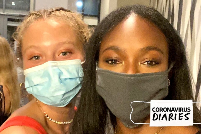 Two friends, freshmen in college, wearing masks.