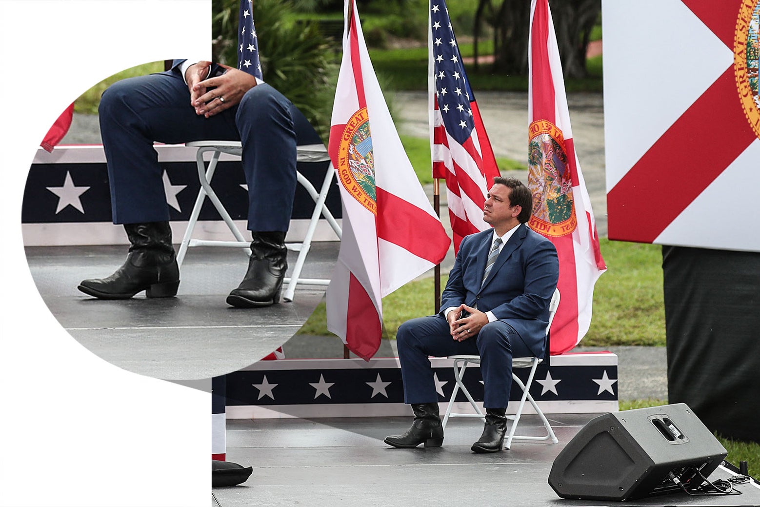 Ron DeSantis sits on stage wearing a pair of high-heeled cowboy boots. 