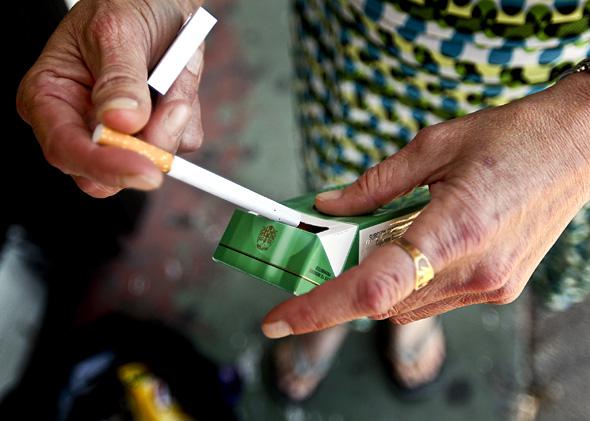 Woman smoking menthol cigarette in Miami, Florida