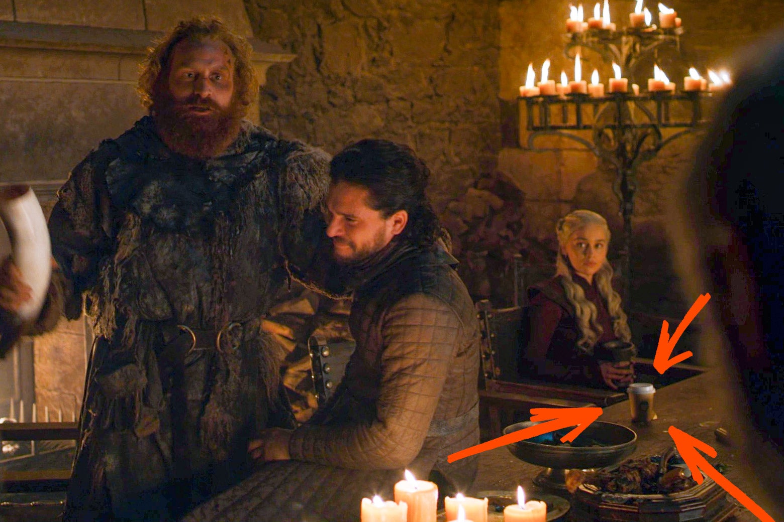 The same still from Game of Thrones Season 8 Episode 4, with red arrows pointing out the disposable coffee cup.