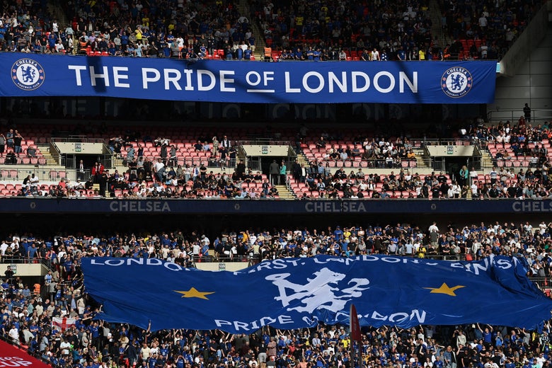 The crowd in blue with a huge Chelsea flag and a banner displaying the team's slogan, "The Pride of London."