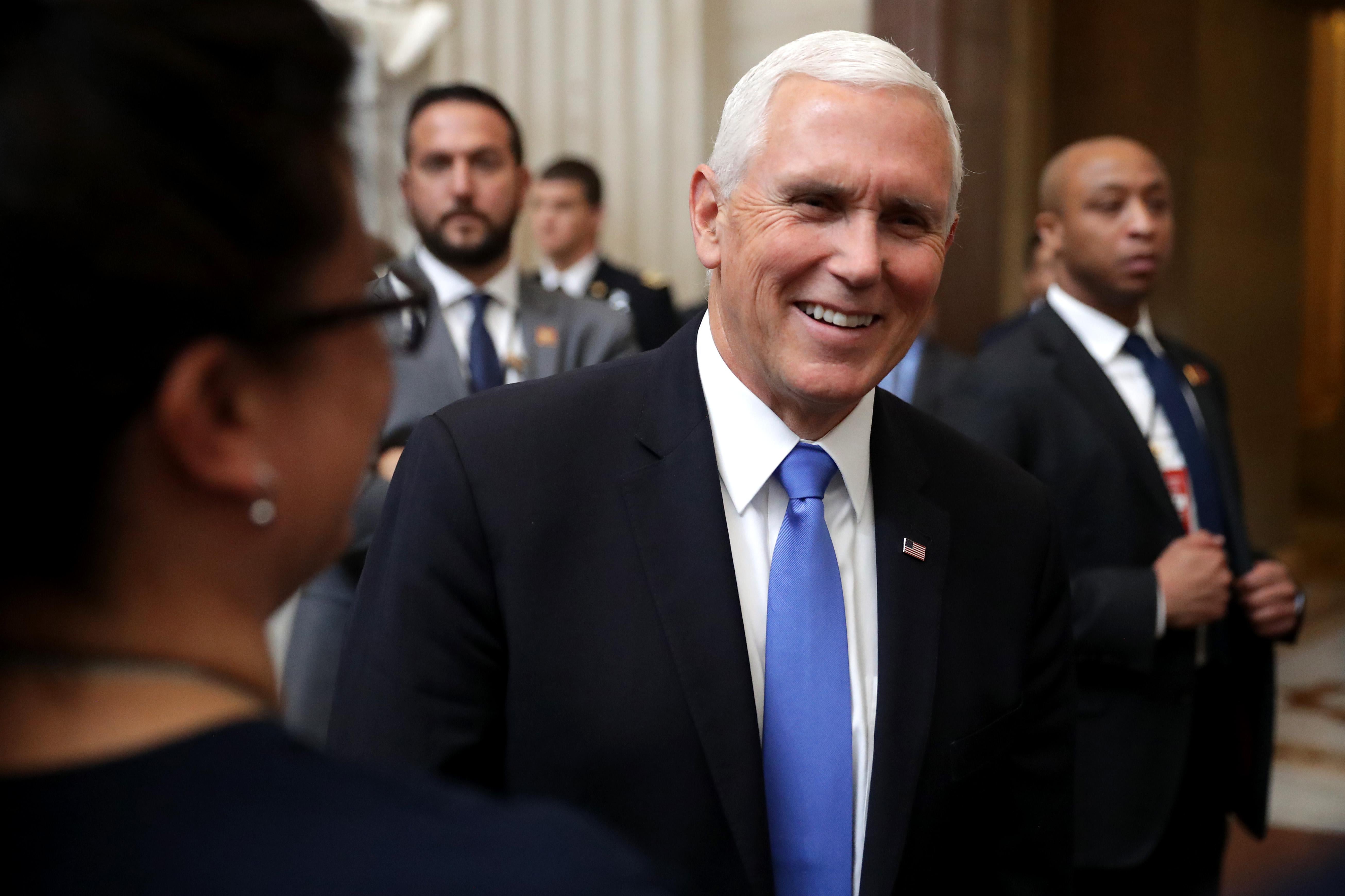 Vice President Mike Pence stops to greet and talk with tourists in the U.S. Capitol Rotunda May 14, 2019 in Washington, D.C.
