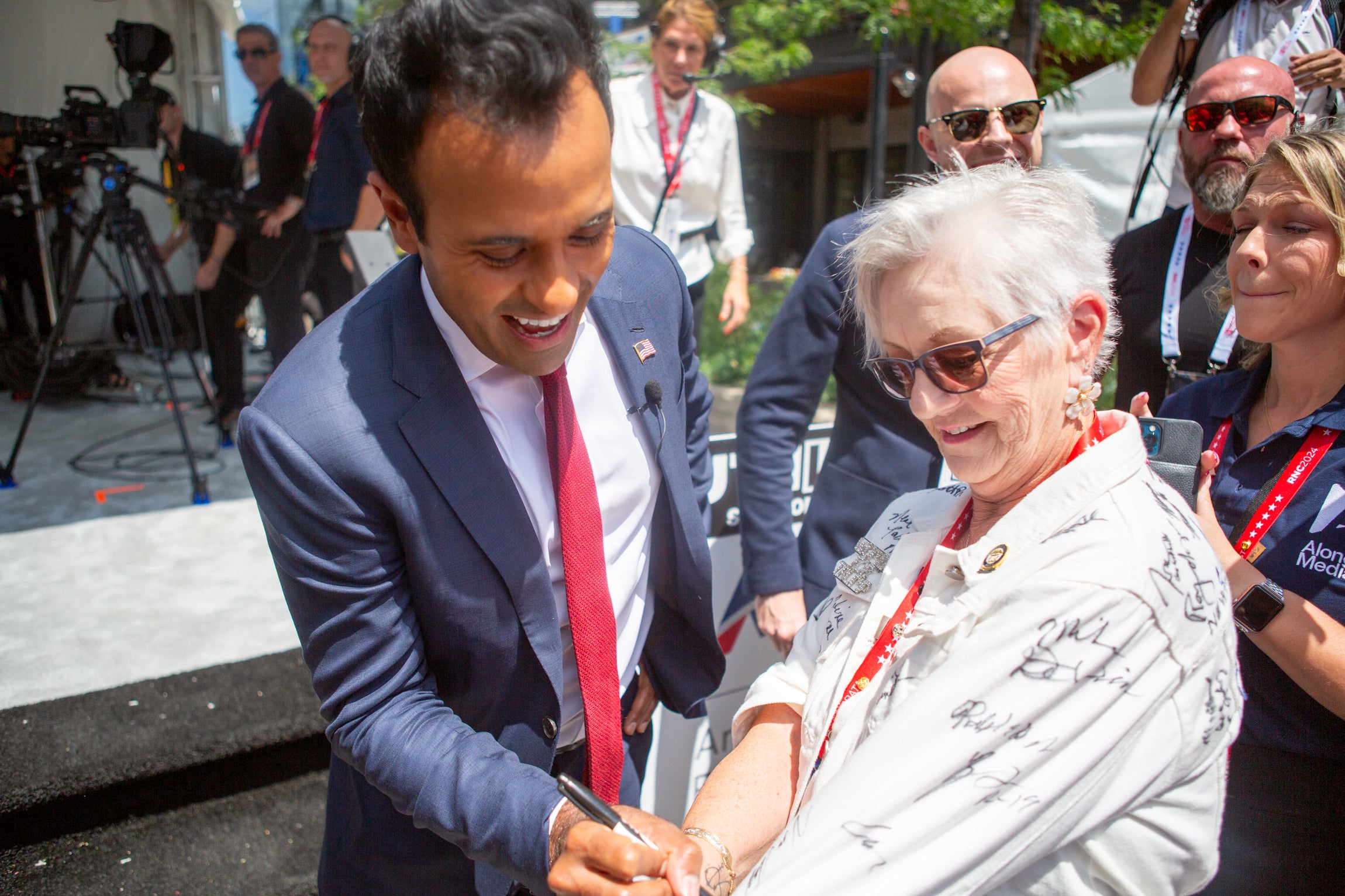 Vivek Ramaswamy, an unlikely rock star at the convention, greeted Maggie Confalone, a delegate from North Carolina, and signed her jacket. She told me she intends on donating it to her local Republican Party for auction.