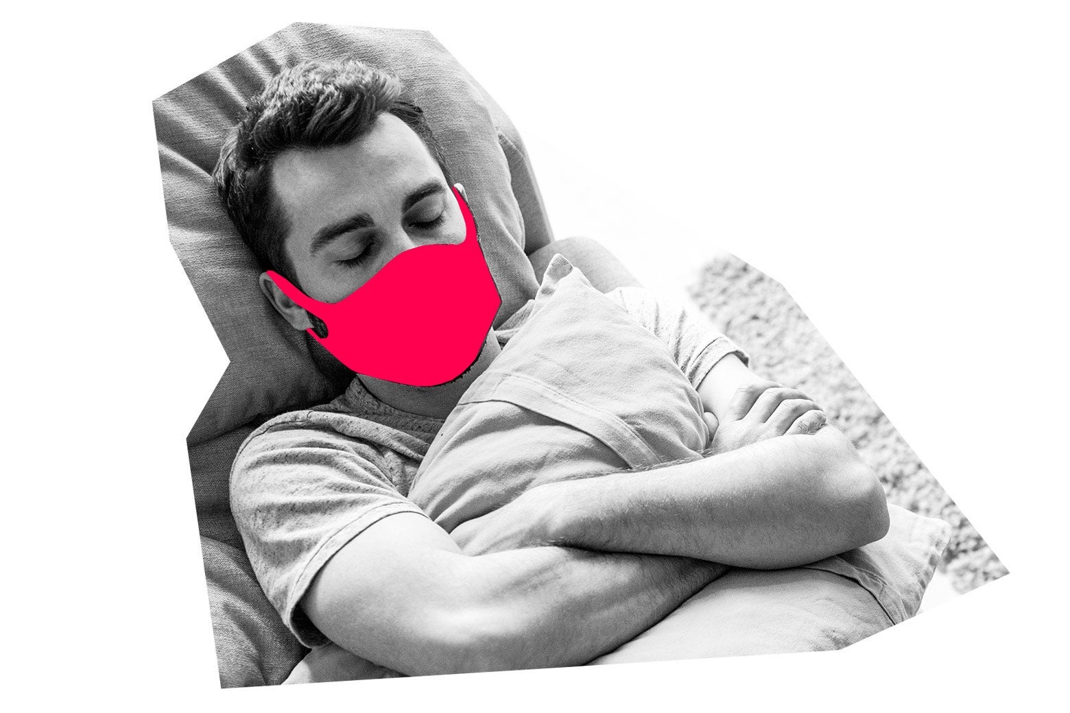 A sleeping man wears a face mask.