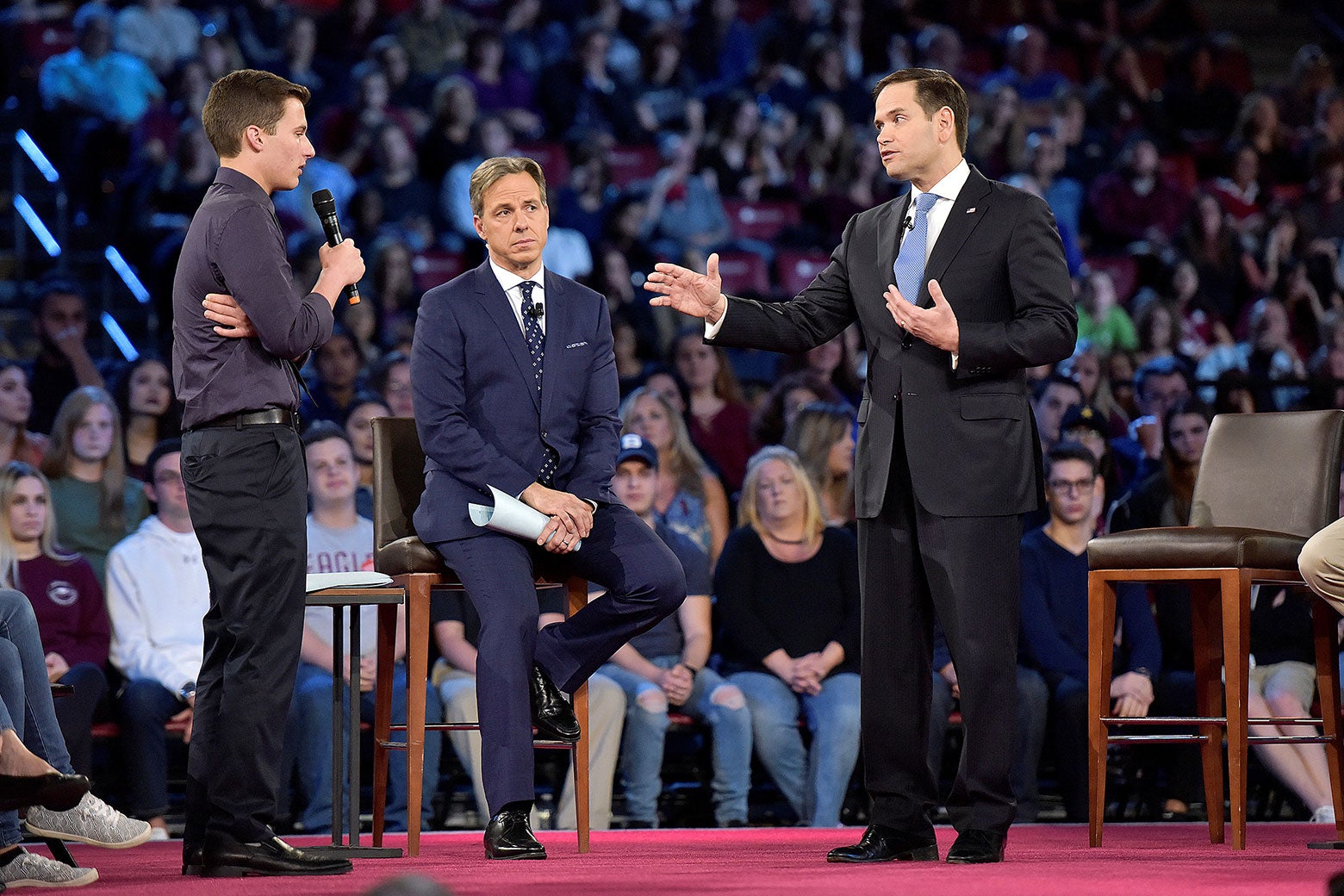 Marjory Stoneman Douglas student Cameron Kasky (L) asks Senator Marco Rubio if he will continue to accept money from the NRA during a CNN town hall meeting, at the BB&T Center, in Sunrise, Florida, U.S. February 21, 2018. 