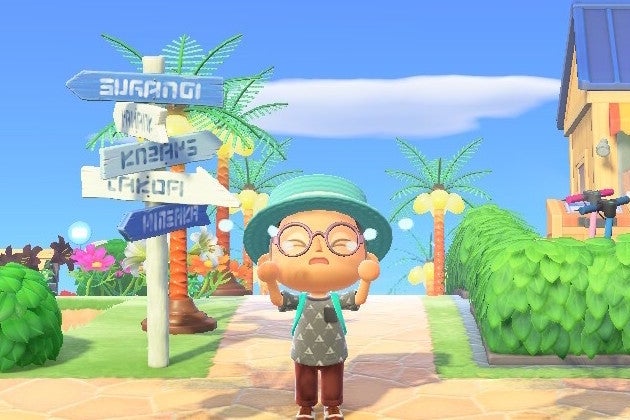 A character wearing glasses, a hat, a backpack, a gray shirt, and red pants stands by a road sign with several arrows pointing left and right. There are green bushes behind him, and a blue sky with a single white cloud above. 