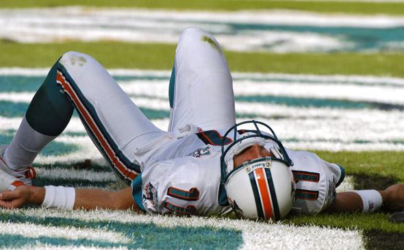 Miami Dolphins quarterback Gus Frerotte is knocked unconscious by the Buffalo Bills defense during the game between the Miami Dolphins and the Buffalo Bills.