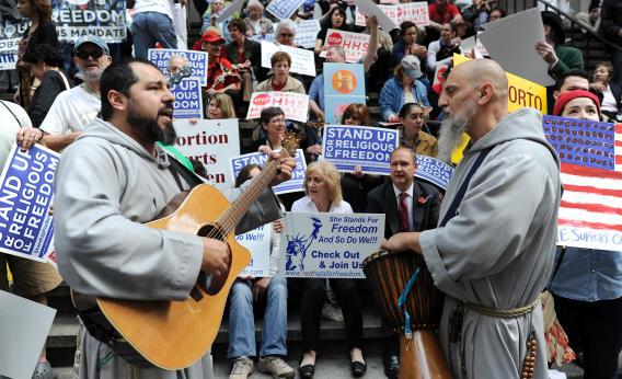 Demonstrators protest a requirement that most employers provide health care insurance coverage for contraception and sterilization as part of the federal health care overhaul at rally in New York on March 23, 2012