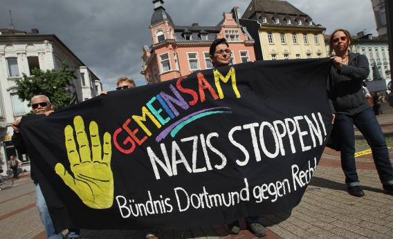 Demonstrators celebrate a court order banning a march by neo-Nazis on Sept. 1 in Dortmund, Germany.