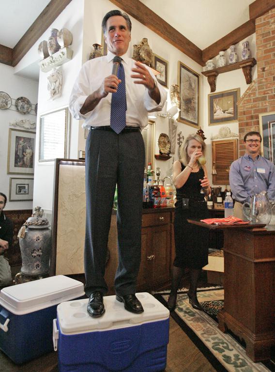 Republican Presidential hopeful Mitt Romney stands on a cooler as he talks to supporters at the private home of Dr. Jed and Mary Tepper, Thursday, Oct. 18, 2008, in Florence, S.C.