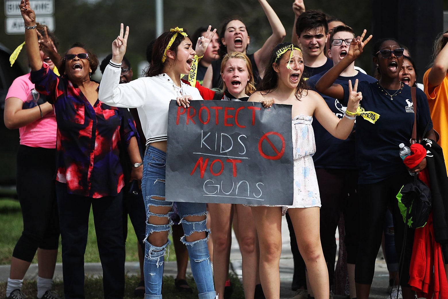 West Boca High School students arrive at Marjory Stoneman Douglas High School after walking in honor of the 17 victims of the previous week’s school shooting, on Tuesday in Parkland, Florida.