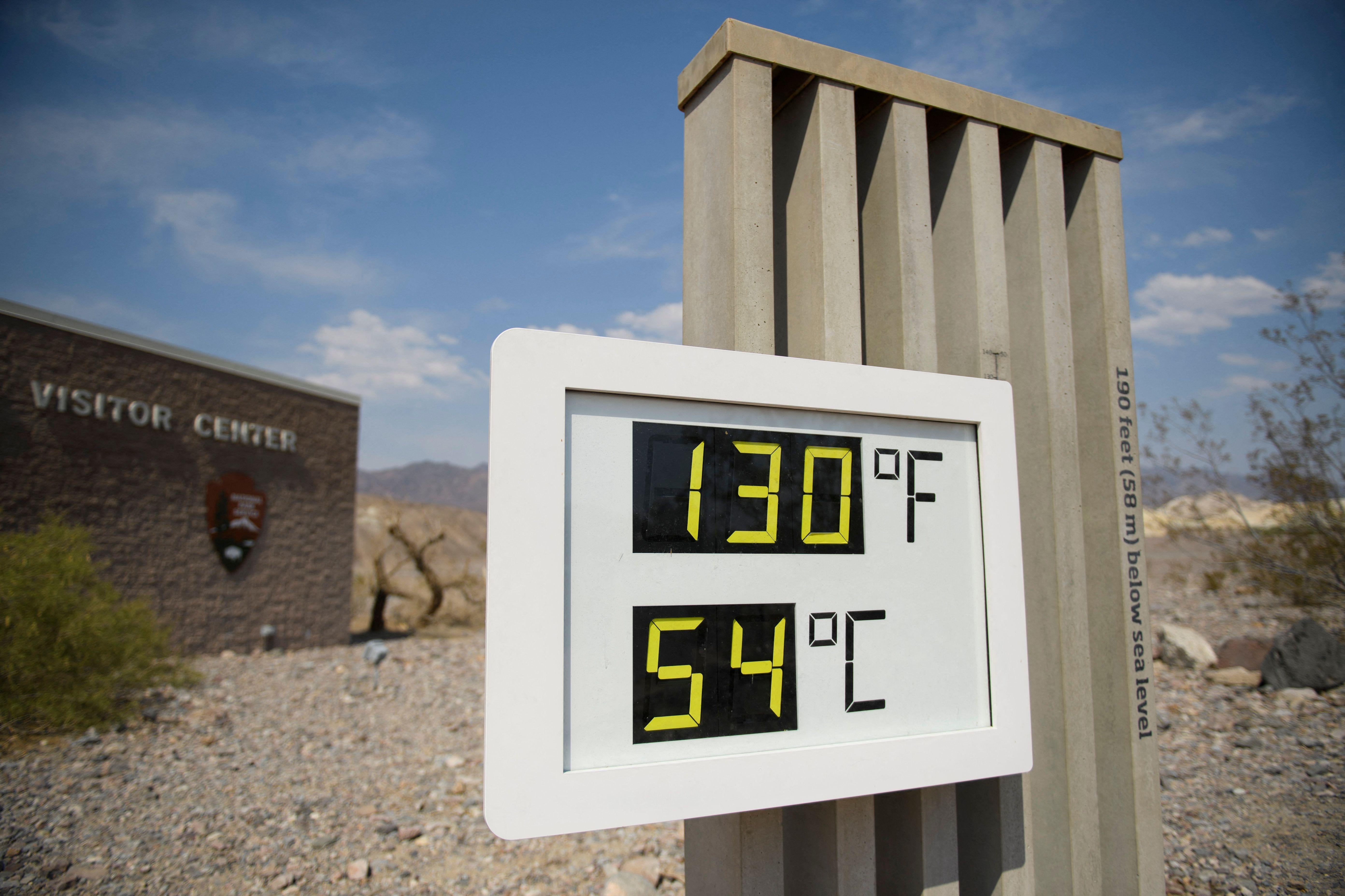 An outdoor thermometer reads 130 degrees Fahrenheit and 54 degrees Celsius.