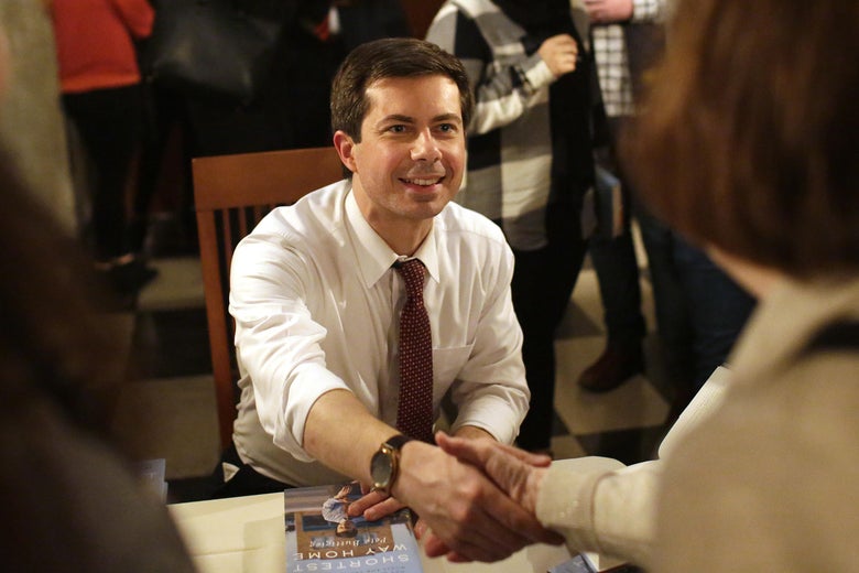 Pete Buttigieg greets a guest as he signs copies of his book in Chicago. 