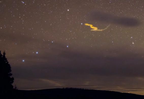 Shooting star trail: Meteor leaves a bright trail behind it.