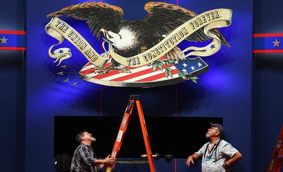 Workers put the finishing touches on the stage on Sunday for the final presidential debate.