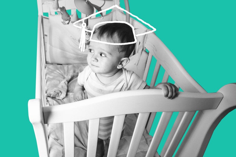 A baby in his crib, with a graduation-cap outline
