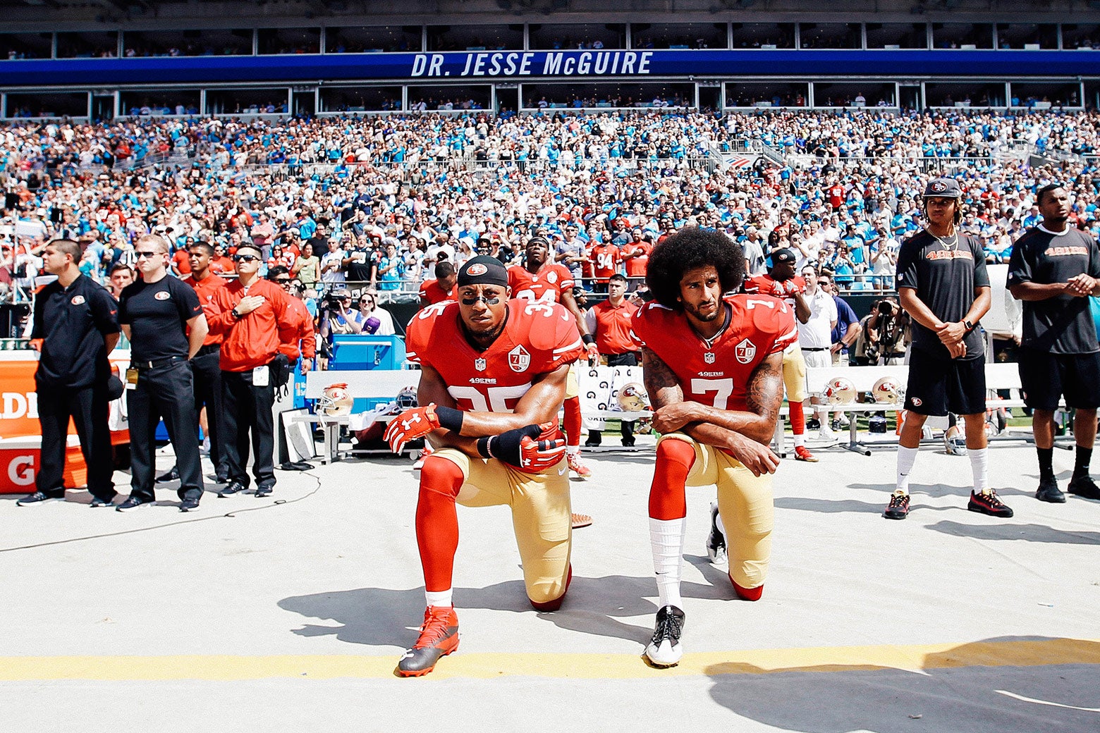 Eric Reid and Colin Kaepernick, then of the San Francisco 49ers, kneel on the sideline during the anthem, prior to a game against the Carolina Panthers on Sept. 18, 2016.