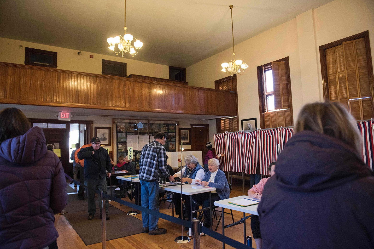 Voters cast their ballots in the U.S. presidential election at the Sutton Town Hall on Nov. 8, 2016, in Sutton, New Hampshire.