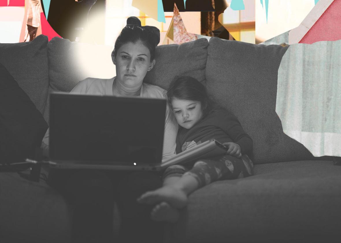 Mother working from home with daughter, seated on couch with laptop. 