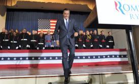 Mitt Romney arrives on the stage during a campaign rally at the Valley Forge Military Academy and College in Wayne, Pa., Friday