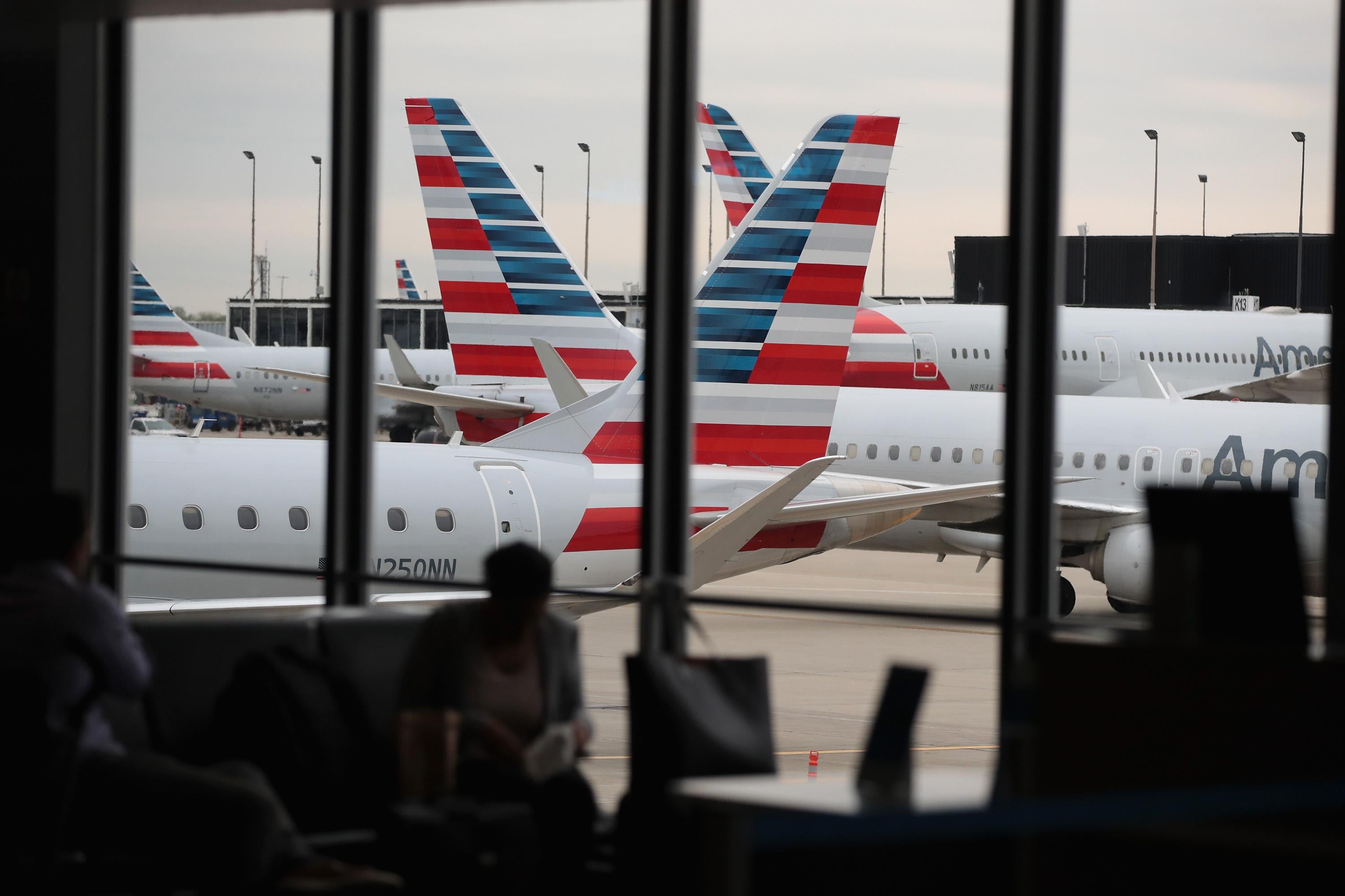 American Airlines aricraft sit at gates at O’Hare International Airport on May 11, 2018 in Chicago, Illinois. 