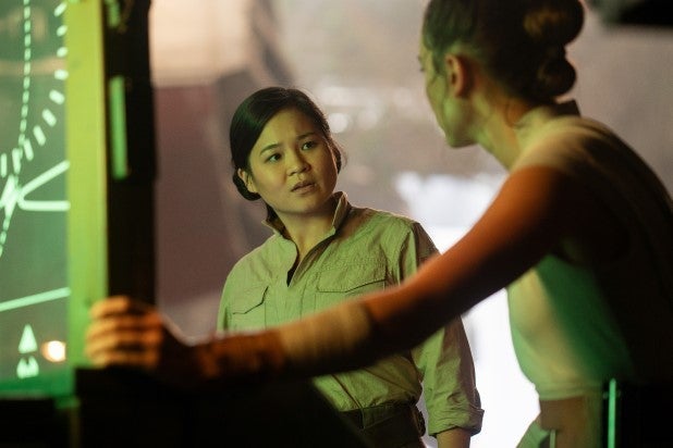 Kelly Marie Tran's Rose Tico in front of a glowing radar screen, with Daisy Ridley's Rey looking on.