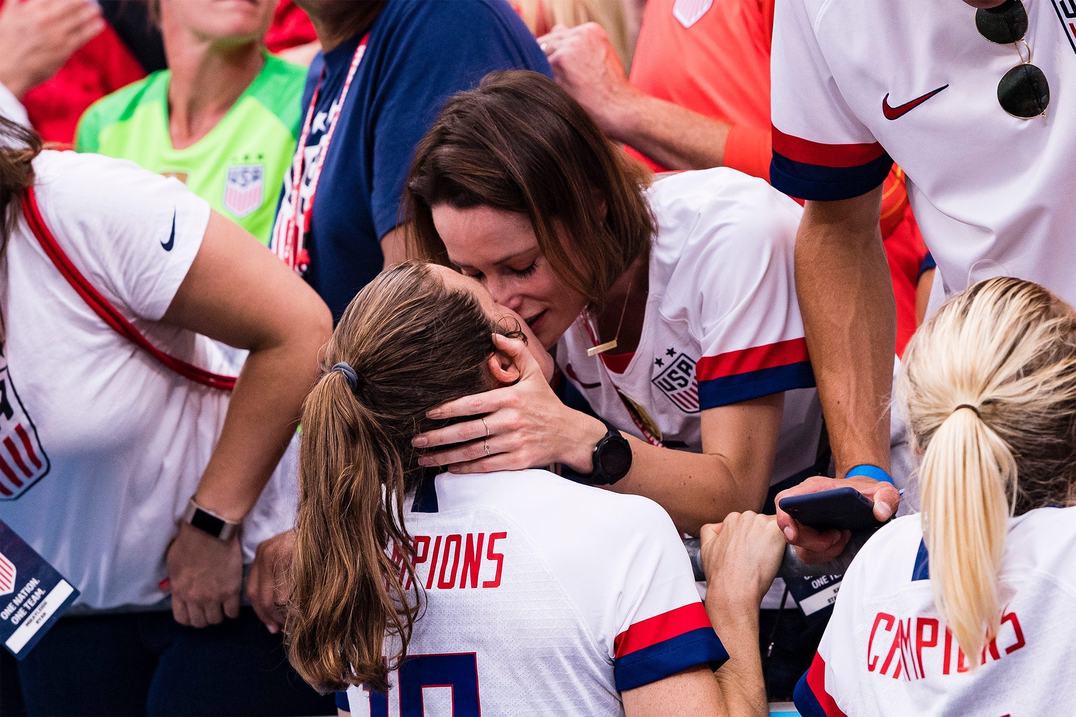 Kelley O'Hara of United States kisses her girlfriend.