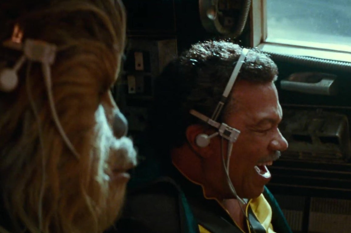 Chewbacca and Lando in the cockpit of the Millennium Falcon, in a still from Star Wars: The Rise of Skywalker.