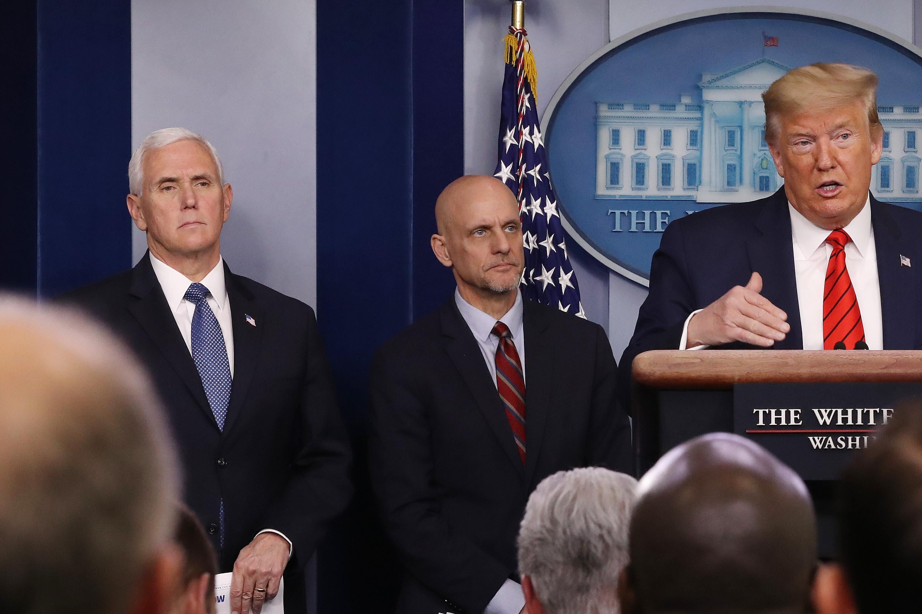 Trump speaks at the podium in the White House press room