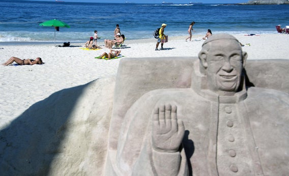 A sand statue depicting Pope Francis at Copacabana beach in Rio de Janeiro. Those who can't make the pilgrimage to World Youth Day can still get the papal indulgences by following the event on social media.