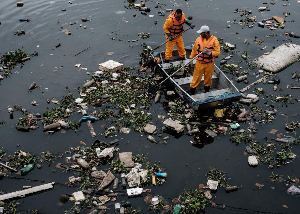 Floating debris caught by the eco-barrier before entering Guanabara Bay, at the mouth of Meriti River near Rio de Janeiro on July 20.