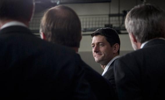House Budget Committee Chairman Rep. Paul Ryan, R-Wis., accompanied by fellow lawmakers, pauses as he arrives to speak during a news conference on the budget, Tuesday, March 12, 2013, on Capitol Hill in Washington.