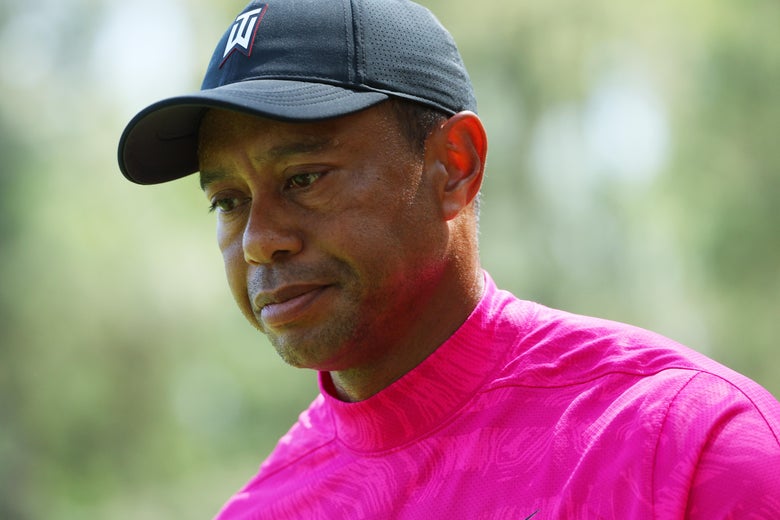 Tiger Woods looking downward, thoughtful, a little dejected