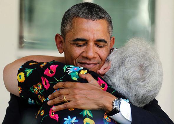 Obama hugging a woman who will benefit from the Affordible Care