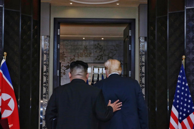 SINGAPORE, SINGAPORE - JUNE 12:  In this handout photograph provided by The Strait Times, North Korean leader Kim Jong-un (L) with U.S. President Donald Trump (R) during their historic U.S.-DPRK summit at the Capella Hotel on Sentosa island on June 12, 2018 in Singapore. U.S. President Trump and North Korean leader Kim Jong-un held the historic meeting between leaders of both countries on Tuesday morning in Singapore, carrying hopes to end decades of hostility and the threat of North Korea's nuclear programme. (Photo by Kevin Lim/The Strait Times/Handout/Getty Images)
