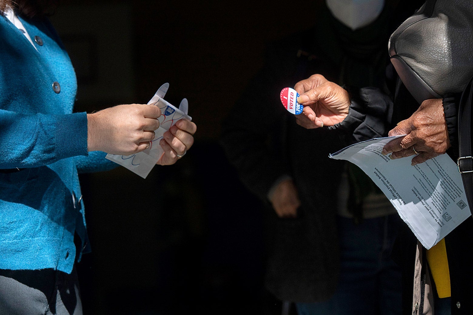 A voter gets an "I Voted" sticker after casting a ballot