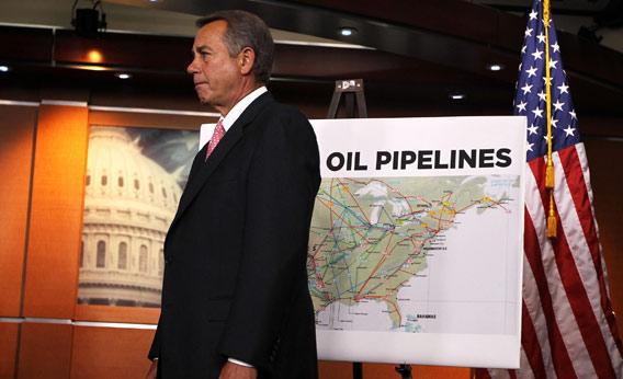 U.S. Speaker of the House Rep. John Boehner (R-OH) stands next to a map of current oil pipelines during a news conference.