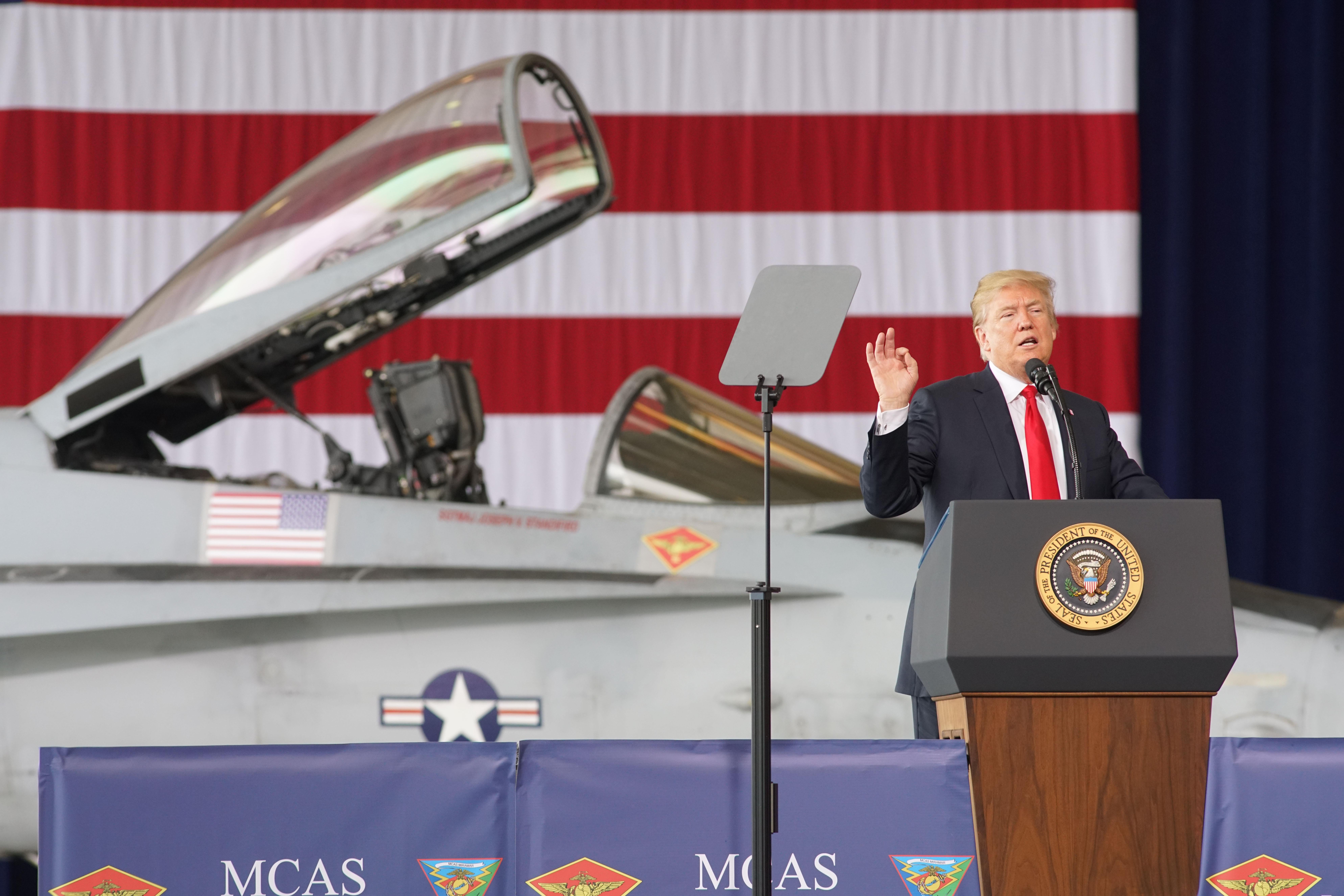 SAN DIEGO, CA - MARCH 13:  President Donald Trump addresses troops at Miramar Marine Corp Air Station on March 13, 2018 in San Diego, California.  President Trump, on his first visit to California, will view the prototype border walls and then attend a fundraiser in Beverly Hills. (Photo by Sandy Huffaker/Getty Images)
