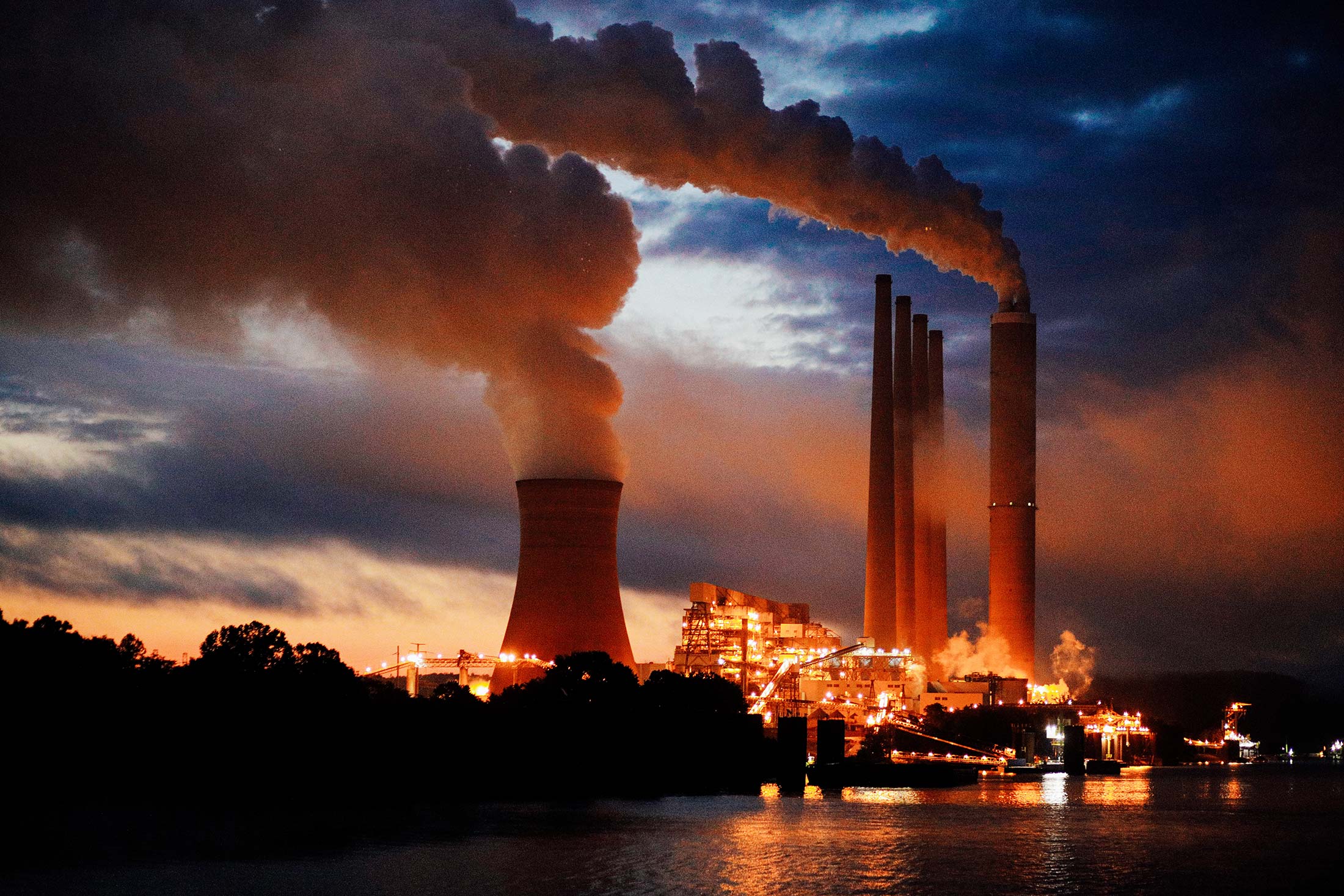 Coal-fired power plant lights up the early morning sky on the banks of the Ohio River.