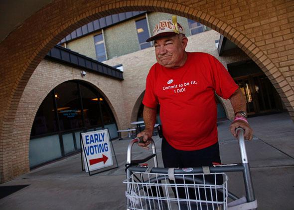 David Nally poses for a portrait after casting his ballot during early voting at the Gila County Recorder’s Office in Globe, Arizona, on Oct. 26, 2012.