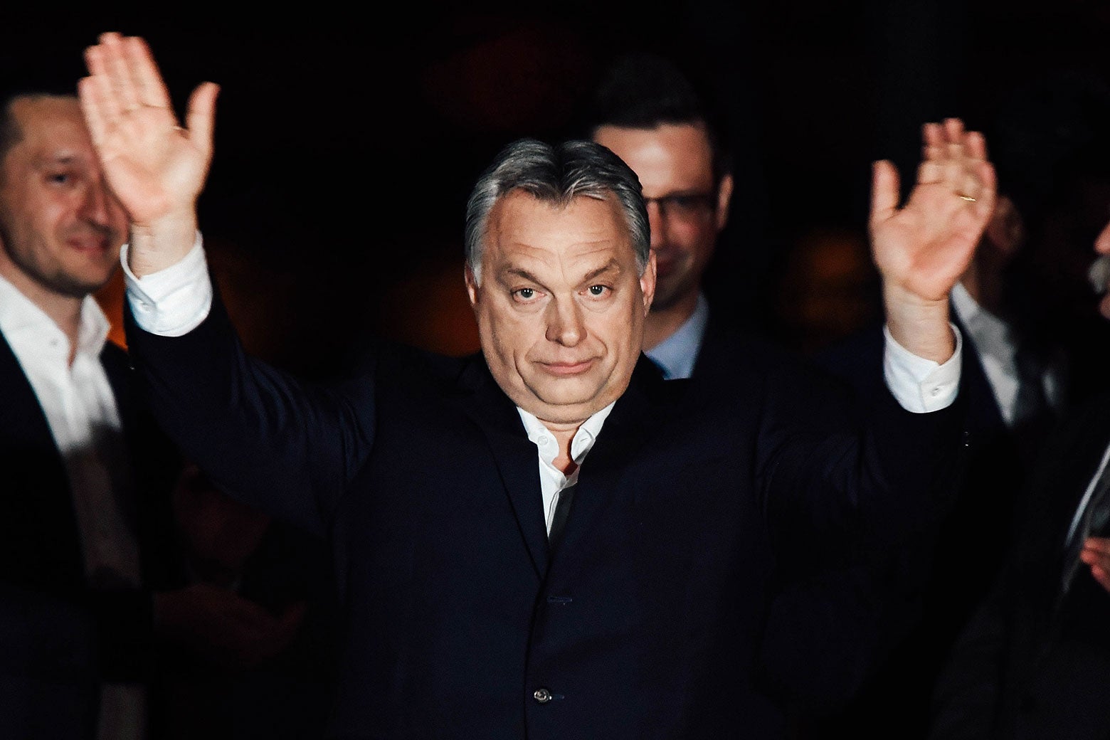 Hungarian Prime Minister Viktor Orbán celebrates on a podium on the bank of the Danube River after winning the parliamentary election with members of his Fidesz party on Sunday in Budapest, Hungary.