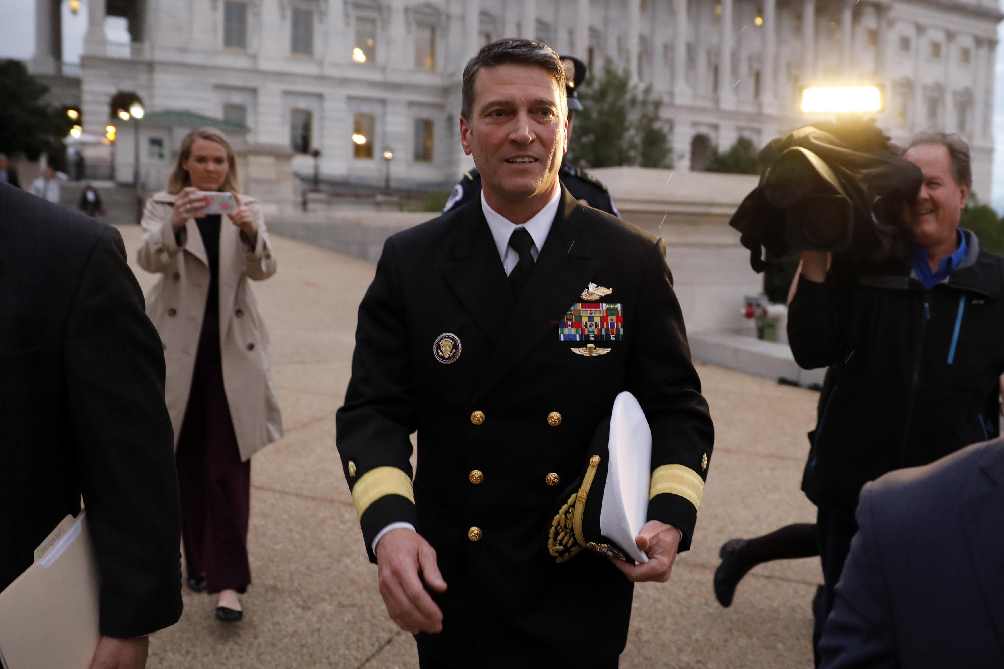 Admiral Ronny Jackson in uniform leaving the U.S. Capitol