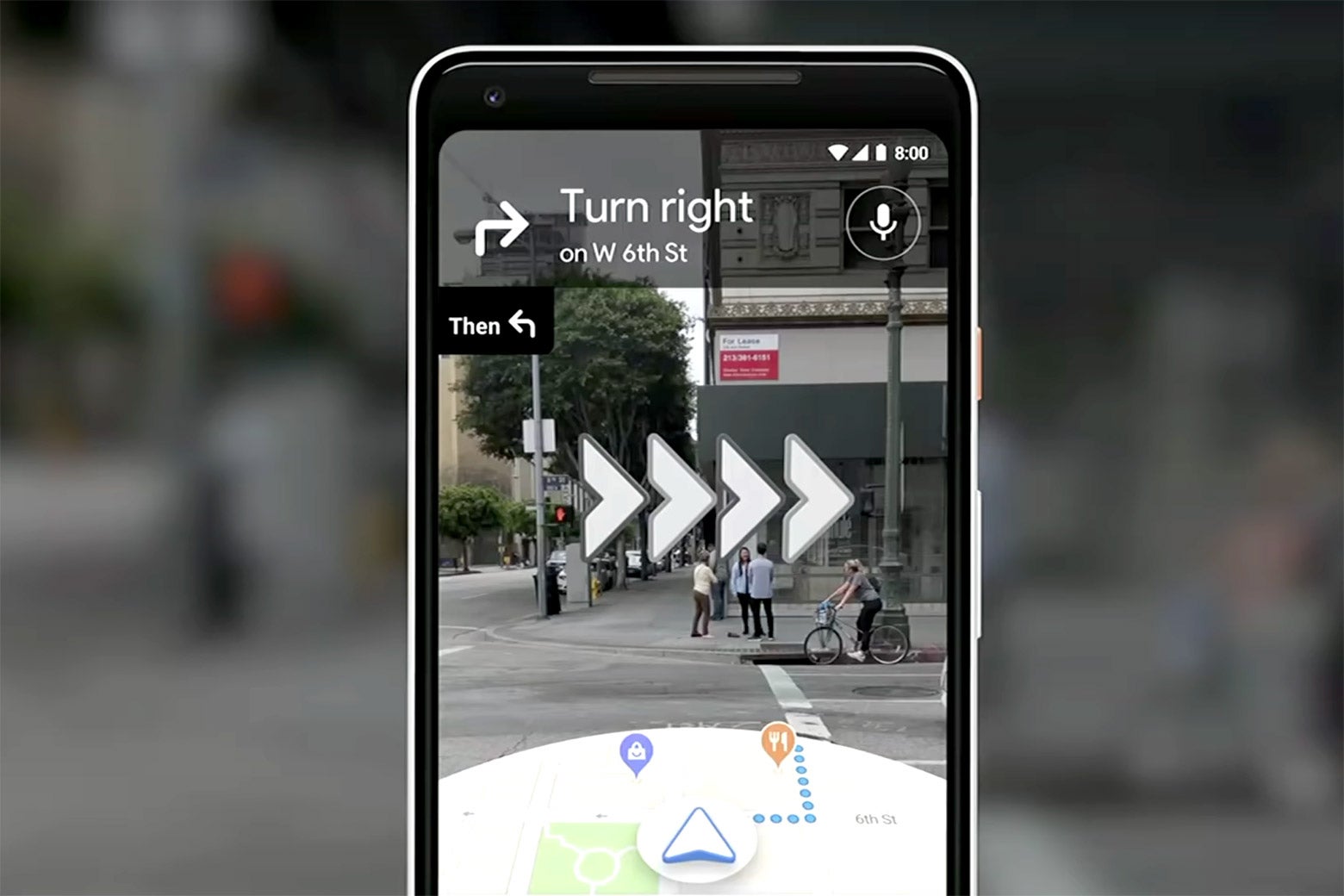A phone displays the augmented reality feature on Google Maps.