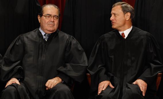 U.S. Supreme Court Associate Justice Antonin Scalia (L) and Chief Justice John Roberts.