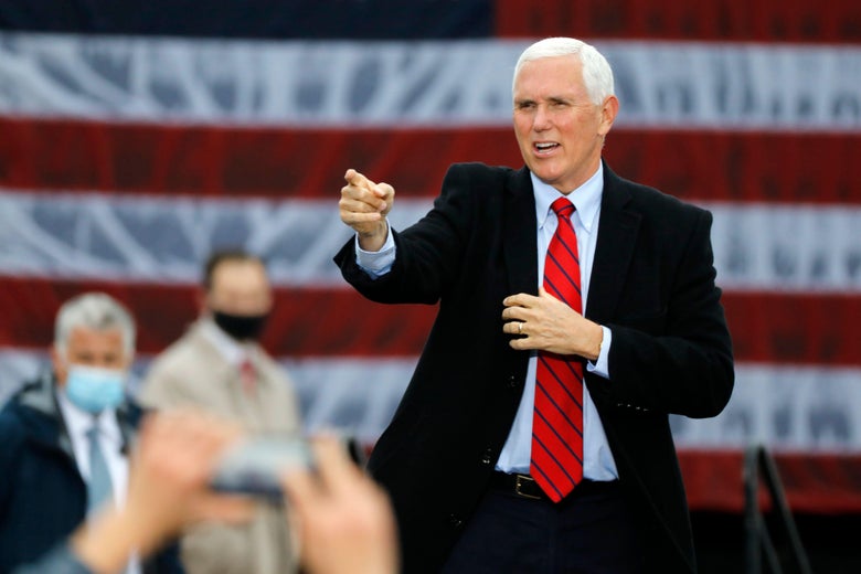 Vice President Mike Pence walks on stage at a campaign rally at Oakland County International Airport in Waterford, Michigan, on October 22, 2020.